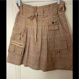 Plaid mini with accent pockets and zippers. XS